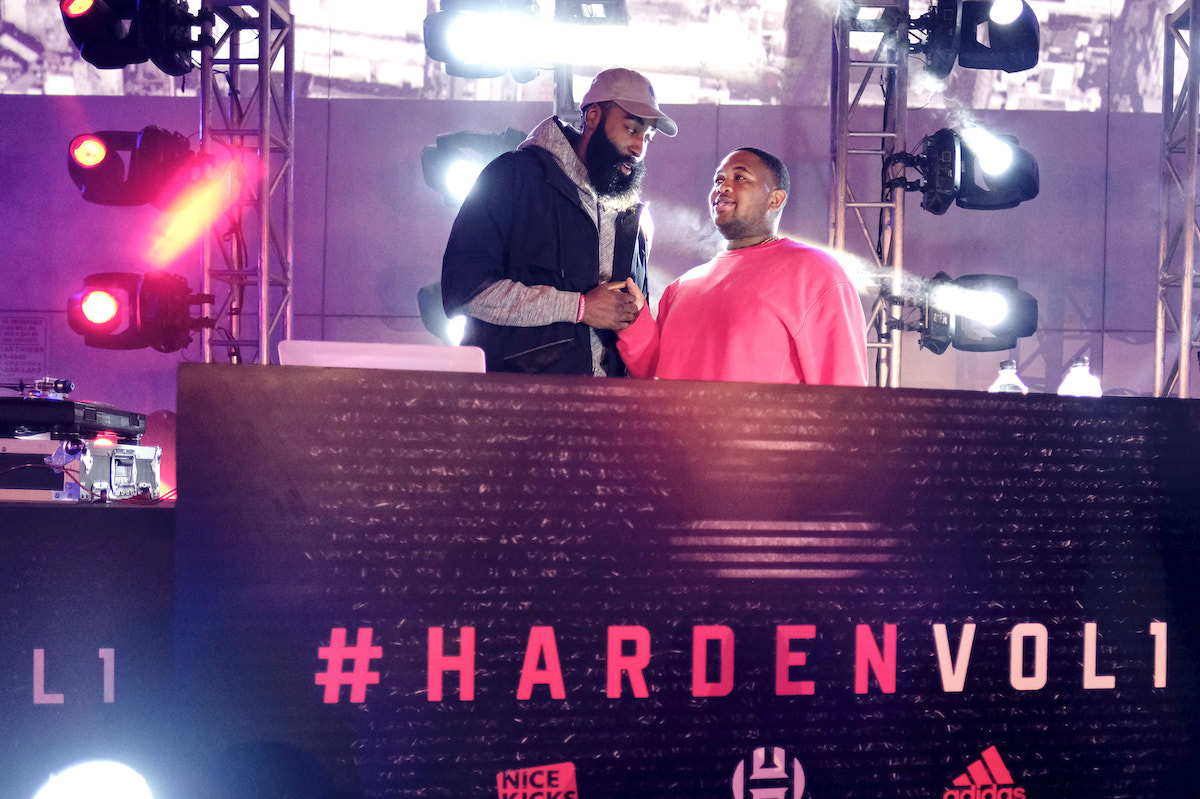 James Harden and a DJ on stage.