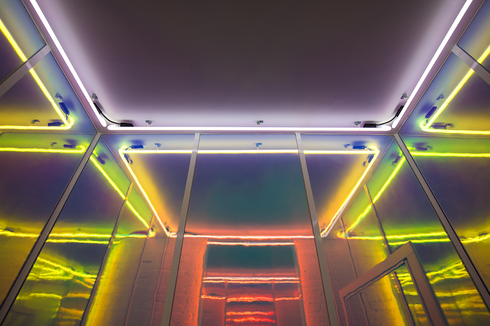 The neon lit ceiling of the fitting room.